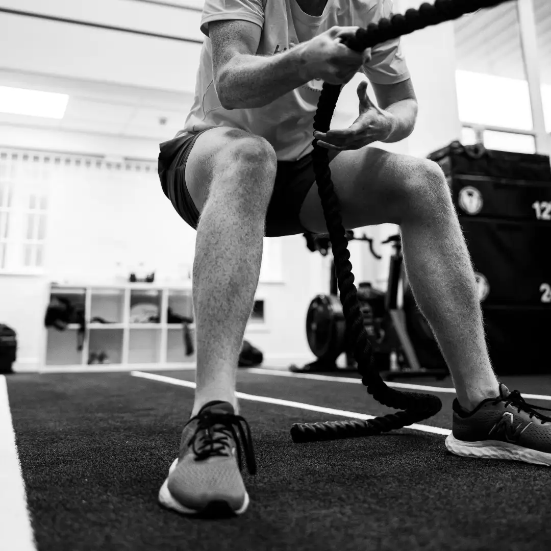 Man pullking a weighted sled in a strength training session at TEAM NTS
