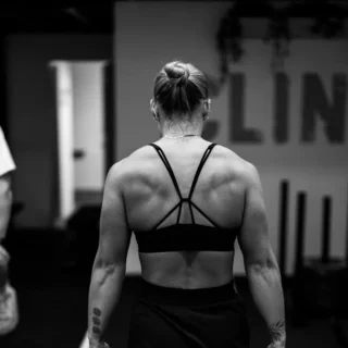 Back view of a female client preparing for a strength training workout at TEAM NTS