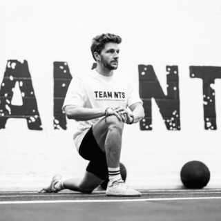 Man stretching out for a training session at TEAM NTS Exeter